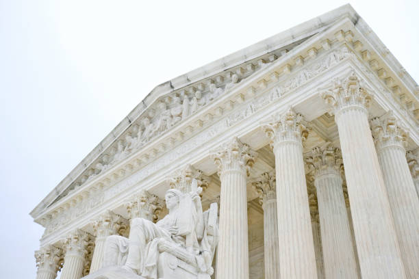 Overcast Supreme Court United States Supreme Court Building in Washington DC on a cloudy overcast day. civil rights act stock pictures, royalty-free photos & images