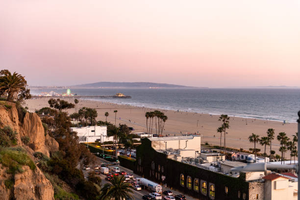 istock Santa Monica Beach and Sunset Light in Background. 1546485502