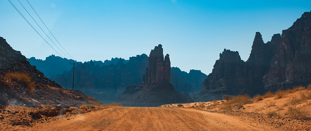 A desert road with mountains in background. An image from Tabuk, Saudi Arabia.