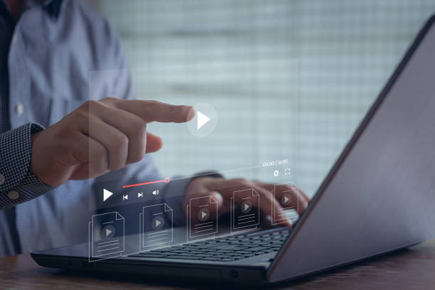 istock Businessman touching play icon on video online. video content creator concept. Video on demand technology, watch online VDO streaming of movies or TV. 1546601040