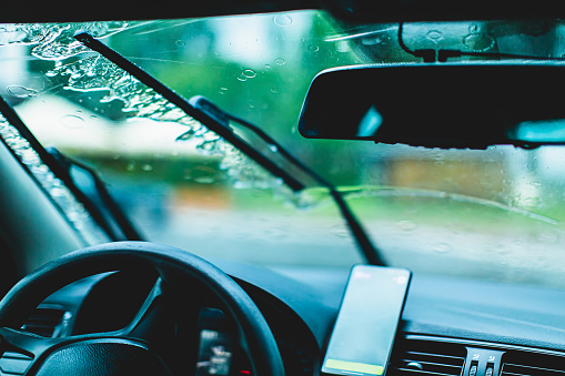 Raindrops on a car window.