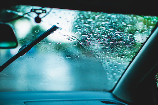 Raindrops on a car window.