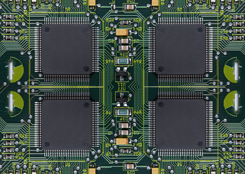 Electronics printed circuit board with four microchips