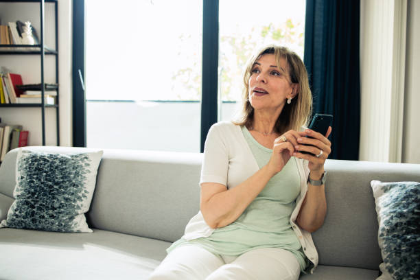 istock Mature woman using smartphone 1546751539