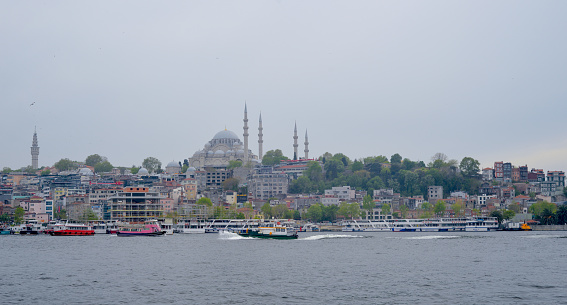 Istanbul, Turkey, May 02, 2023: View of the mosque in cloudy weather over the Bosphorus and Kadika