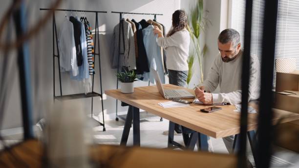 istock E-commerce. Small business owners running online store. 1546812163