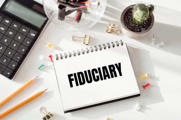 istock Paper notebook with the text Fiduciary on office table 1546813461
