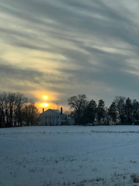 istock Sun setting during the winter over an historic house. 1546816558