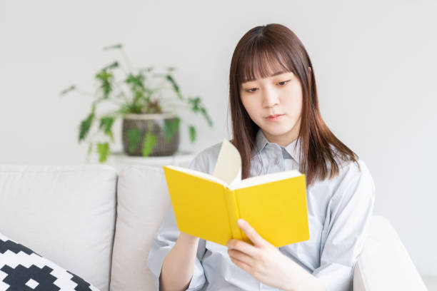 istock attractive asian woman who reads a book, 1546820122