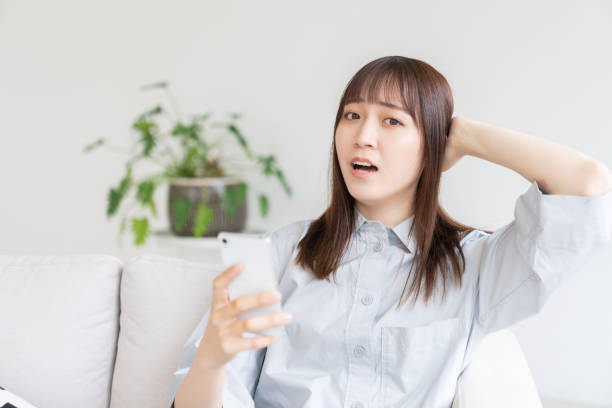 istock attractive Asian woman using a smartphone,think, 1546820129