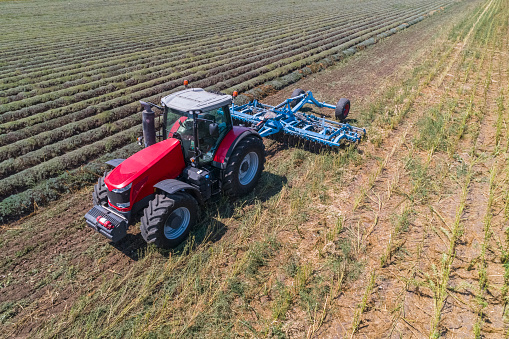 Modern agricultural tractor isolated on a white background