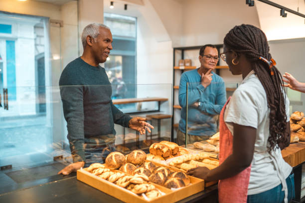 istock Diverse Customers Buying Baked Goods In Small Artisan Bakery 1546822247
