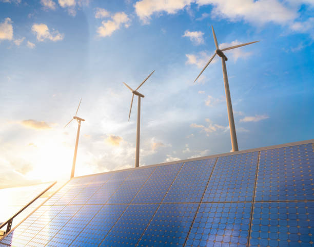 istock Alternative energy concept with wind turbines and solar panels 1546822777