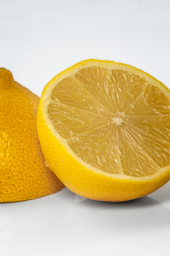Close up of two halves of a cut lemon