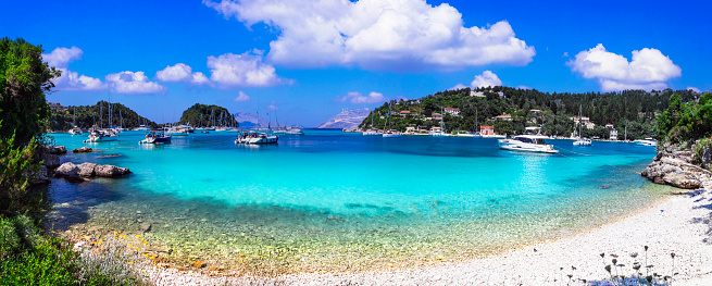 Beautiful small ionian greek island Paxos. view of wonderful scenic beach and bay Lakka with sailng boats. Greece travel