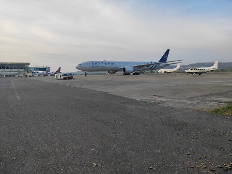 Boeing 737 Classic, Airbus A320, Cessna 208 Grand Caravan and Boeing 777-300ER at Sultan Iskandar Muda Internasional Airport Apron Aceh.