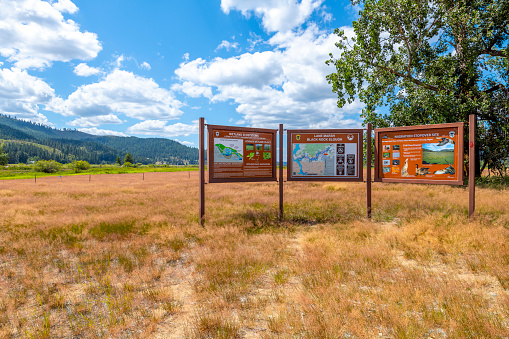 View of the Black Rock Slough signs marking the Wetlands and bird migration site at the 385-acre riverfront parcel of land along the White Pine Scenic Byway in Coeur d'Alene, Idaho USA.