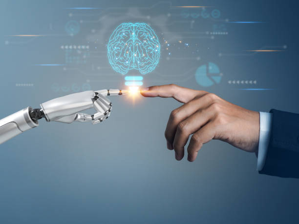 istock Robotic and human hands touch the futuristic light bulb innovation. 1547181096