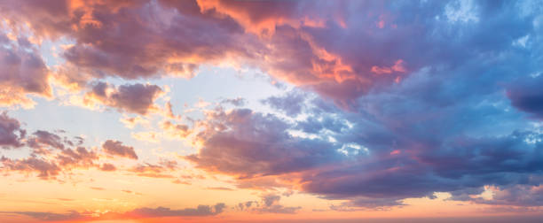 istock Majestic real sunrise sundown sky background with gentle colorful clouds 1547290429