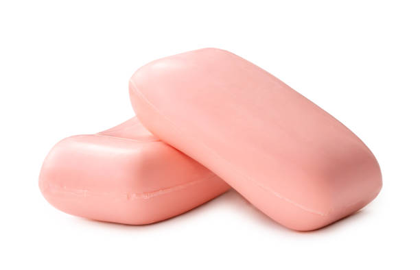 istock Two dry pink soap bars in stack isolated on white background with clipping path. 1547293221