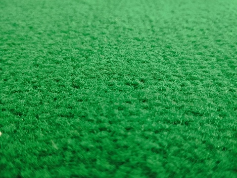 Texture of fiber green carpet shoot on details