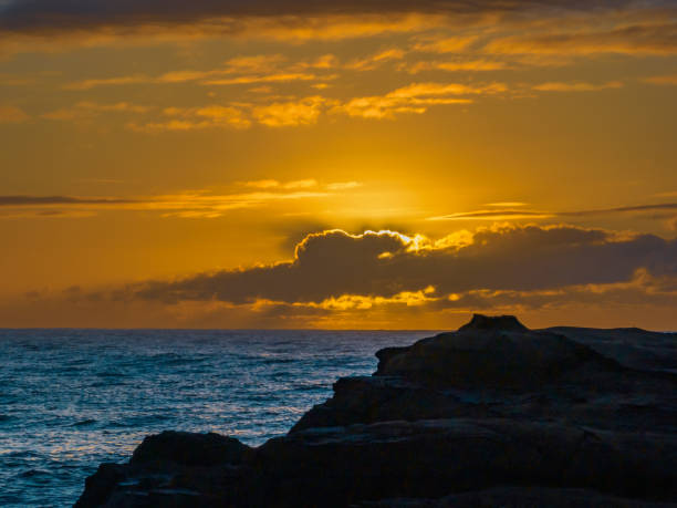 istock Sunrise and sunrays over the ocean 1547426964