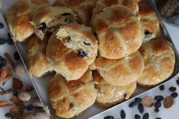 istock Hot cross buns. A sweet fruit bun lightly spiced with cinnamon and nutmeg and marked with a cross on top. Made to serve on Good Friday 1547452993