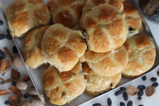 istock Hot cross buns. A sweet fruit bun lightly spiced with cinnamon and nutmeg and marked with a cross on top. Made to serve on Good Friday 1547453018