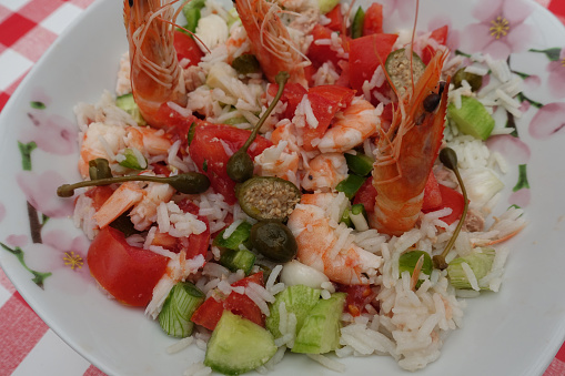 Salad composed of rice shrimp large capers onion  Buffet meal