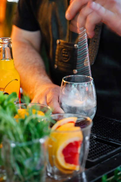 istock Blurred motion of bartender mixing a fresh cocktail in the bar with a bar spoon 1547522100
