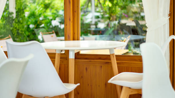 istock White wooden round dining table with chairs. Modern designer. 1547528325
