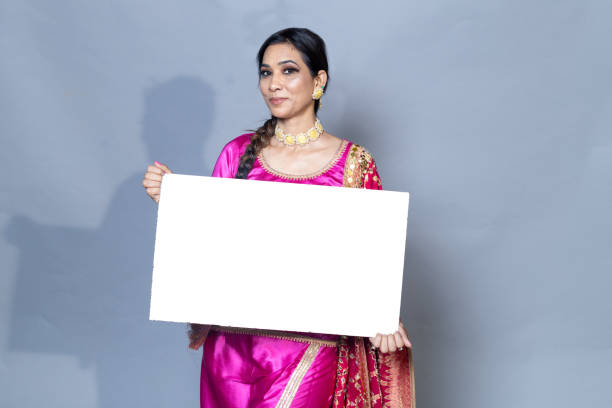 istock A Punjabi woman with sign board looking towards the camera studio shot 1547544281