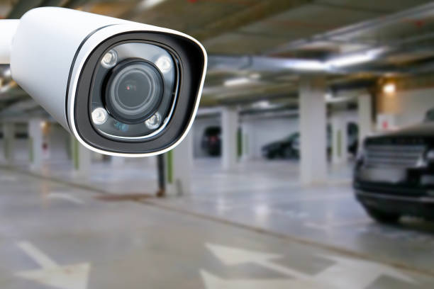 istock cctv camera installed on the parking lot to protection security. Copy space. 1547606493