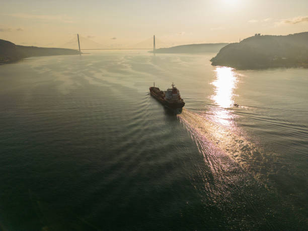 istock Aerial view tanker ship with liquid bulk cargo in transit at sunrise. 1547647791