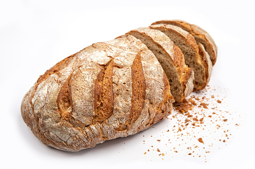 sliced organic sour dough bread loaf on white background