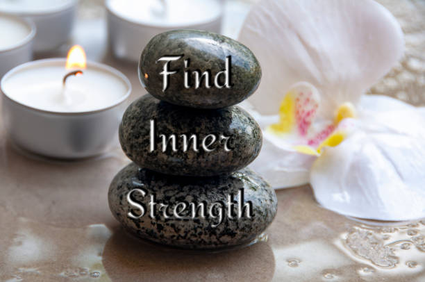 istock Find inner strength text engraved on black zen stones. Motivational concept. 1547669354