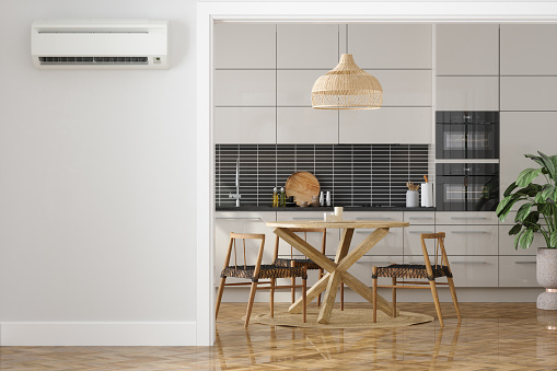 Air Conditioner On Empty Wall With Modern Kitchen Interior Background