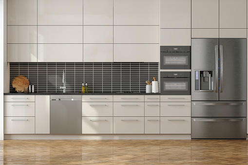 Modern Kitchen Interior With Front View Of Cabinets, Refrigerator, Dishwasher And Oven