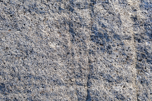 A close-up wall of stone background refers to a detailed and focused view of a wall featuring an image or pattern depicting gazelles. This particular background serves as a decorative element or visual backdrop, often used in various settings such as photography studios, artistic displays, or themed environments.