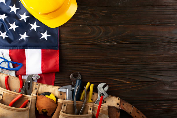 istock Tools hardhat toolbelt and us flag on wooden background labor day banner mockup 1547739880