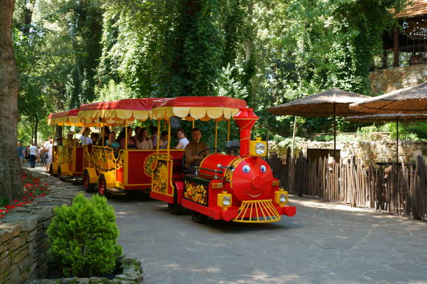 Kamensk-Shakhtinsky, Russia, July 2023. Children's train with children on the territory of the Loga Park. Recreation and entertainment.