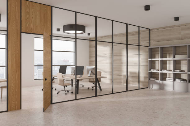 istock Cozy business coworking interior with pc computer, glass doors and window 1547747356