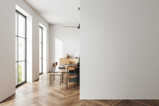 istock Stylish living room interior with table and panoramic window, empty wall 1547750538