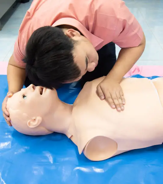 First aid CPR - breathing check. Basic life support training.
