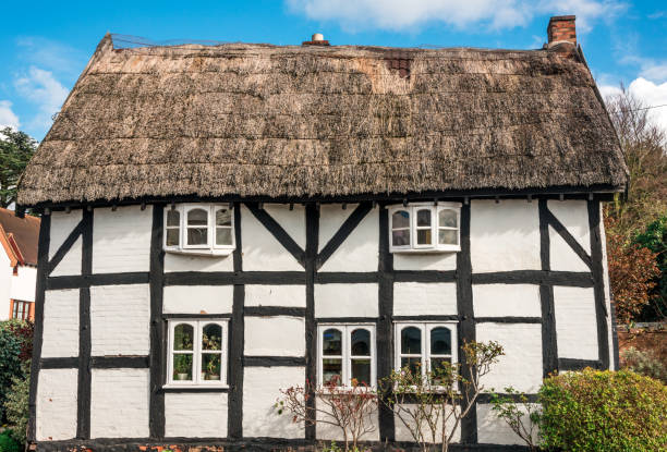 Picturesque English antique cottage. stock photo