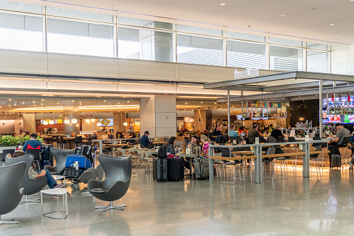 San Francisco, California - April 04, 2019: San Francisco International Airport Departures Area.  Restaurant in Background