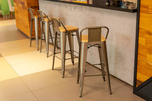 istock Empty high chairs at the bar counter in a cafe or bar 1547889443