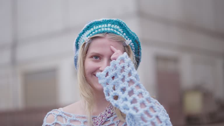 Woman In Knitted Accessories Smiling Widely