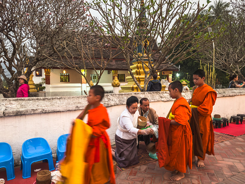 Young Buddhist monks admiring view of ancient temples in Bagan, Myanmar (Burma)