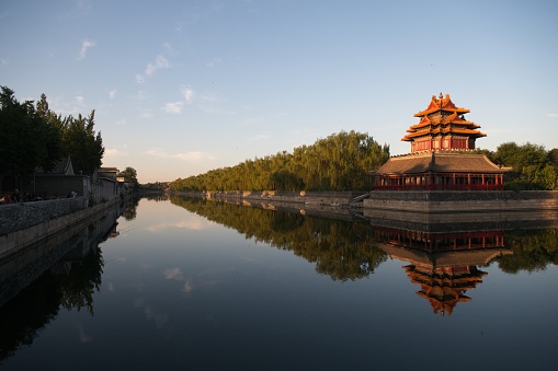 Outside of Forbidden city during and a bit after sunrise. Mostly Forbidden city is surrounded by moat and each corner is ancient watch tower.